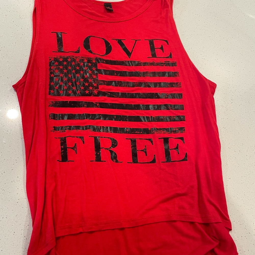 Large.  Comes down a little longer in back so black tank cute.  Worn once.